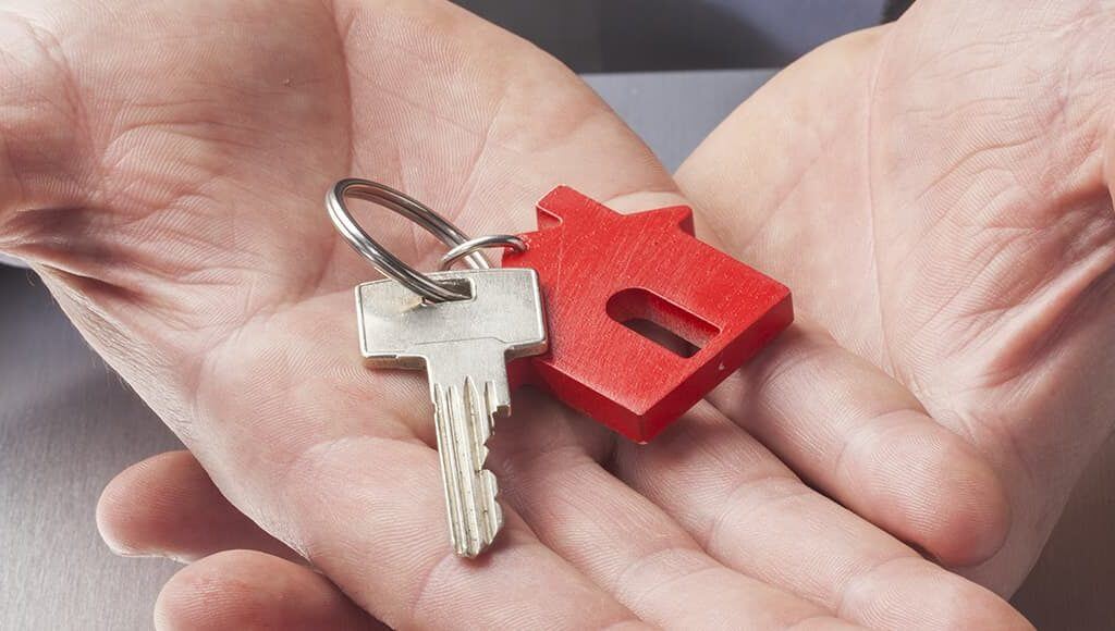 Buy To Let Tax Changes - image - hands holding keys with house keyring