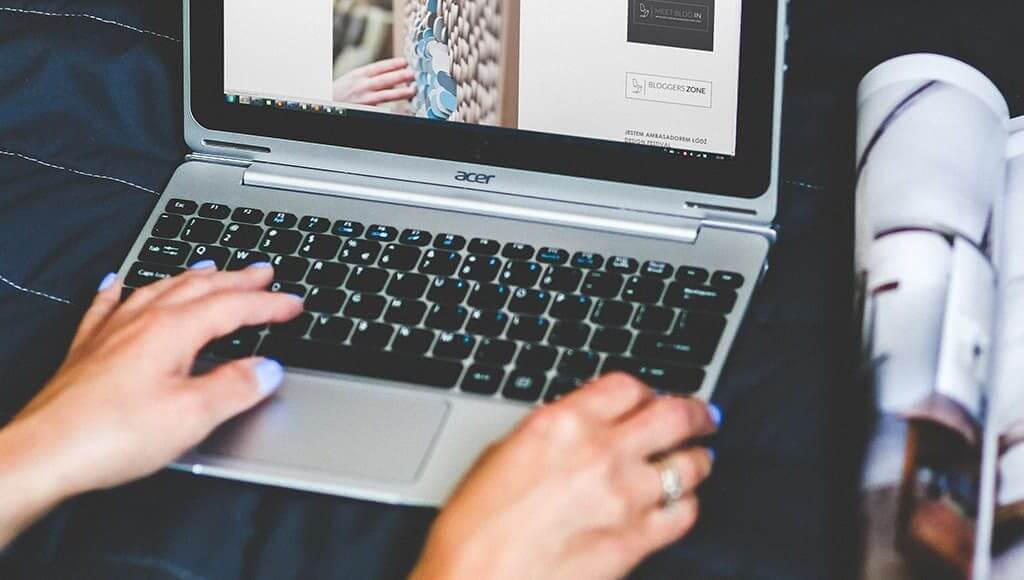 The Guardian's Women in Leadership Editor, Harriet Minter, on the Power of Part Time - image - Woman's hands working on a laptop