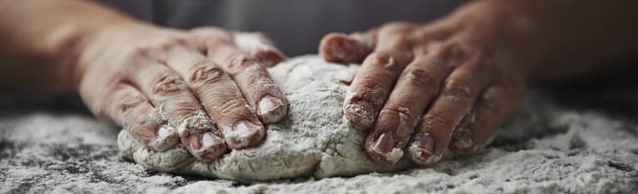 How to Start a Cake Baking Business image - man's hands kneading dough