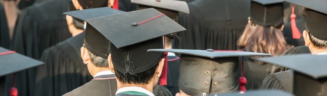 How University Can Open Your Mind to Enterprise - image - backs of university students heads wearing graduation caps