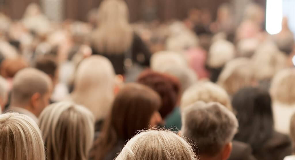 A large group of entrepreneurs networking at an event