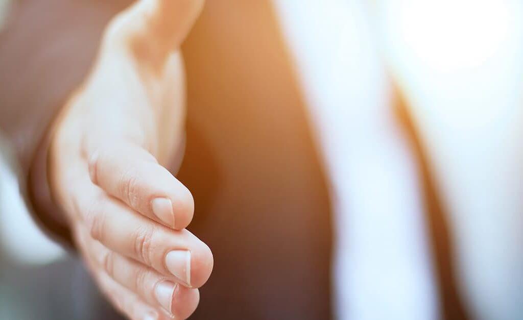 So You’ve Just Formed? Here’s Six Things You Need to do Next… - image - Man in suit about to shake hands