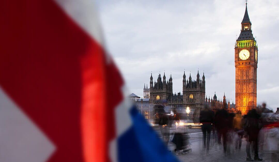 Which Political Party is Best for Small Businesses image - houses of parliament and Big Ben tower in the distance behind a union flag